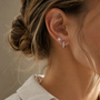 DHARIN Mini Diamond Huggie Earrings - ear wearing lifestyle, huggie flush to earlobe, quiet luxury