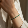 DHARIN Emerald Tennis Bracelet - wrist wearing lifestyle, vivid green emerald, quiet luxury