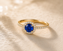 DHARIN Gemstone Halo Cocktail Ring - 18K gold vermeil, blue sapphire center, pavé band, side light view