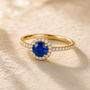 DHARIN Gemstone Halo Cocktail Ring - 18K gold vermeil, blue sapphire center, pavé band, side light view