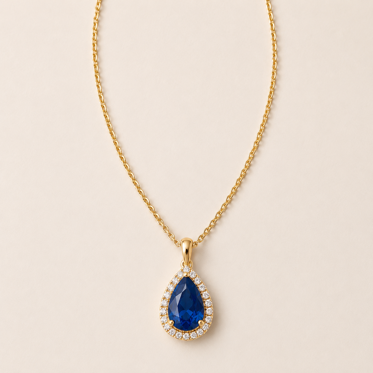 DHARIN Teardrop Gemstone Pendant - emerald 18K gold vermeil, flat lay overhead view