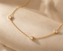 DHARIN Station Diamond Layering Necklace - macro detail, round brilliant diamonds on fine gold chain