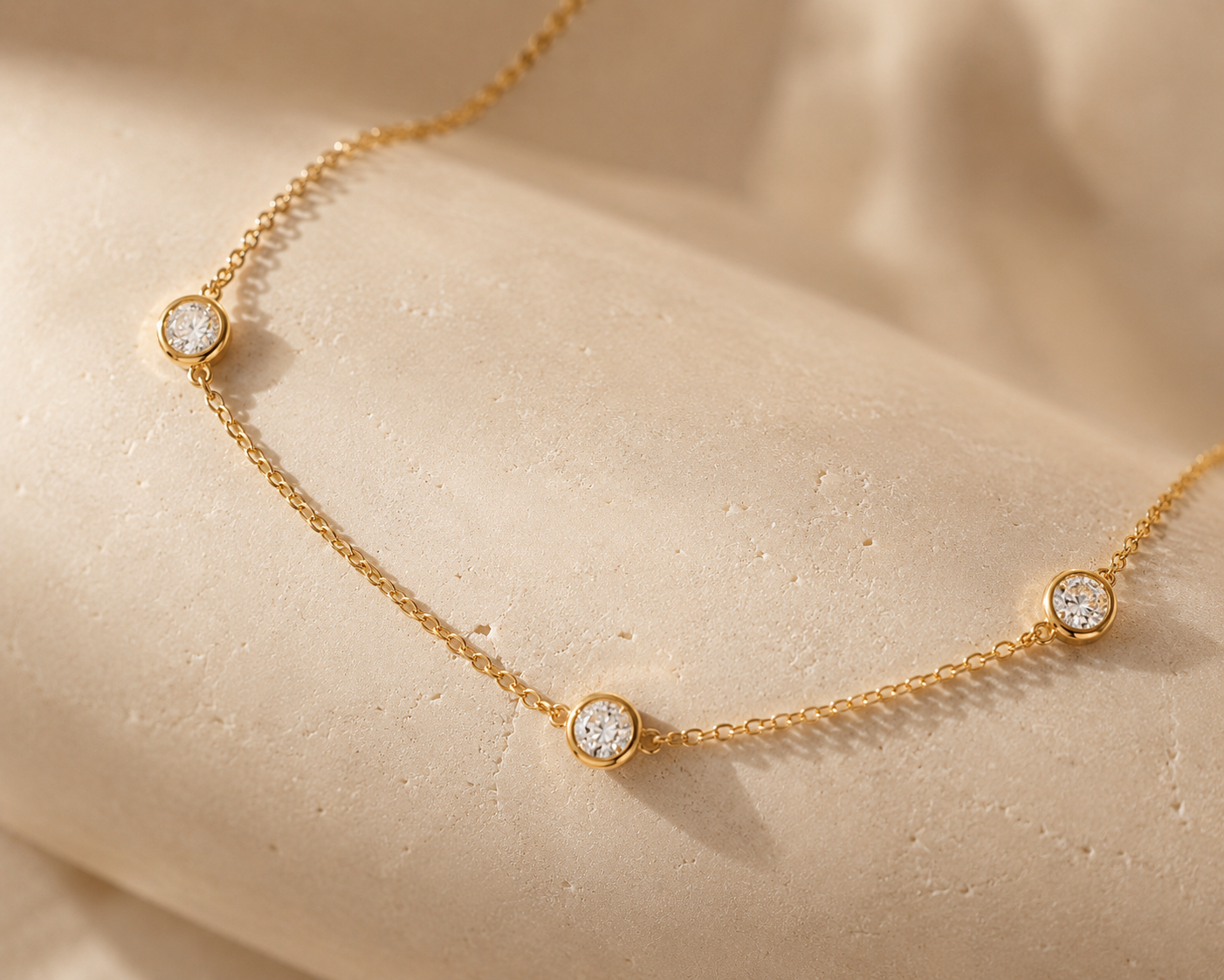 DHARIN Station Diamond Layering Necklace - macro detail, round brilliant diamonds on fine gold chain