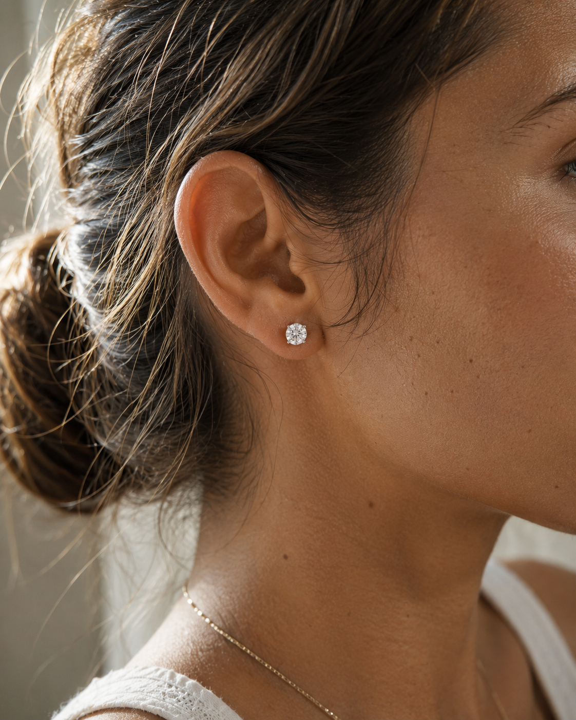 DHARIN Solitaire Lab Diamond Stud Earrings - ear side profile wearing view, 1ct round brilliant, quiet luxury lifestyle