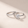 DHARIN Stackable Micro-Pavé Eternity Band paired with oval solitaire ring