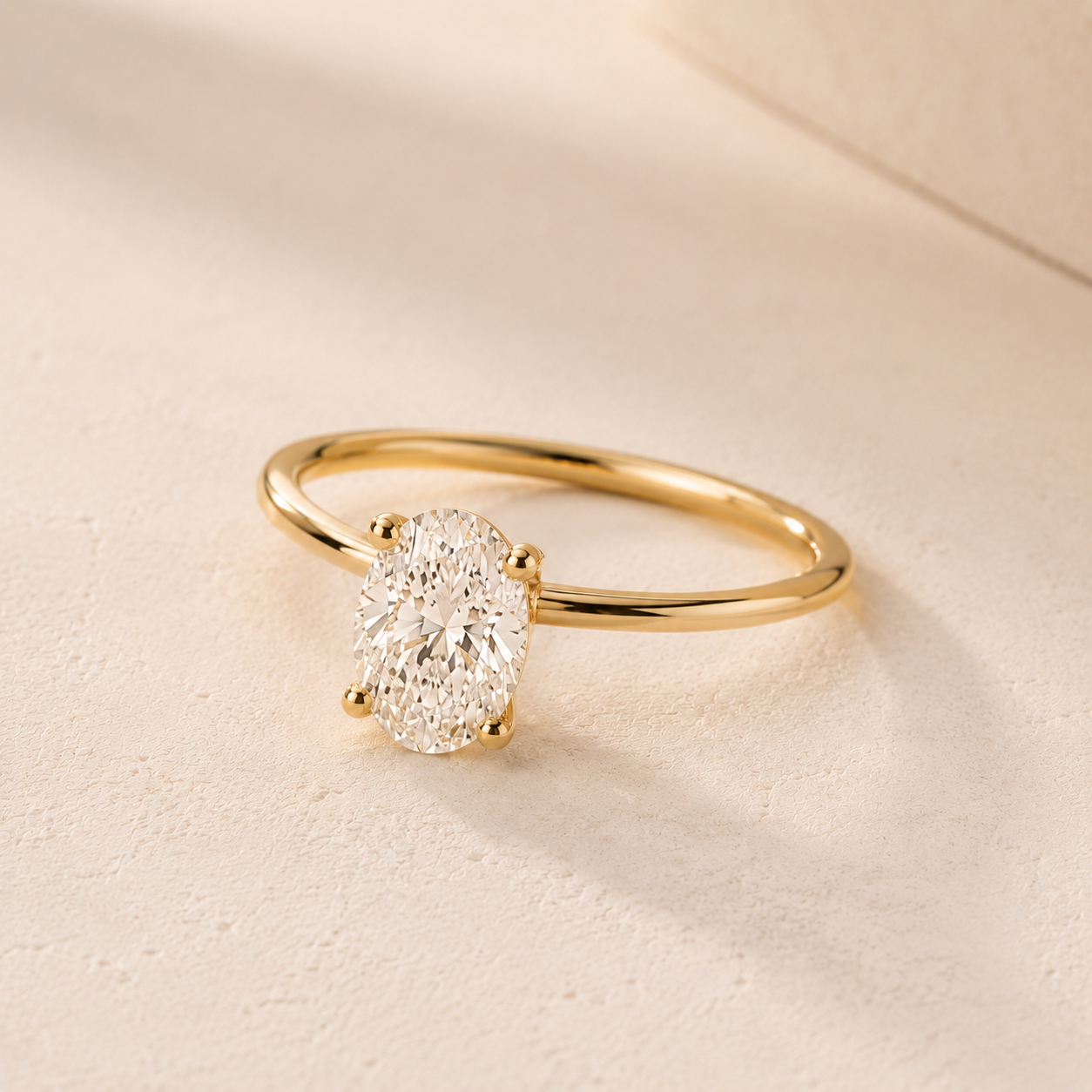 DHARIN Oval Solitaire Ring Slim Band - 45 degree view, four-claw oval diamond solitaire