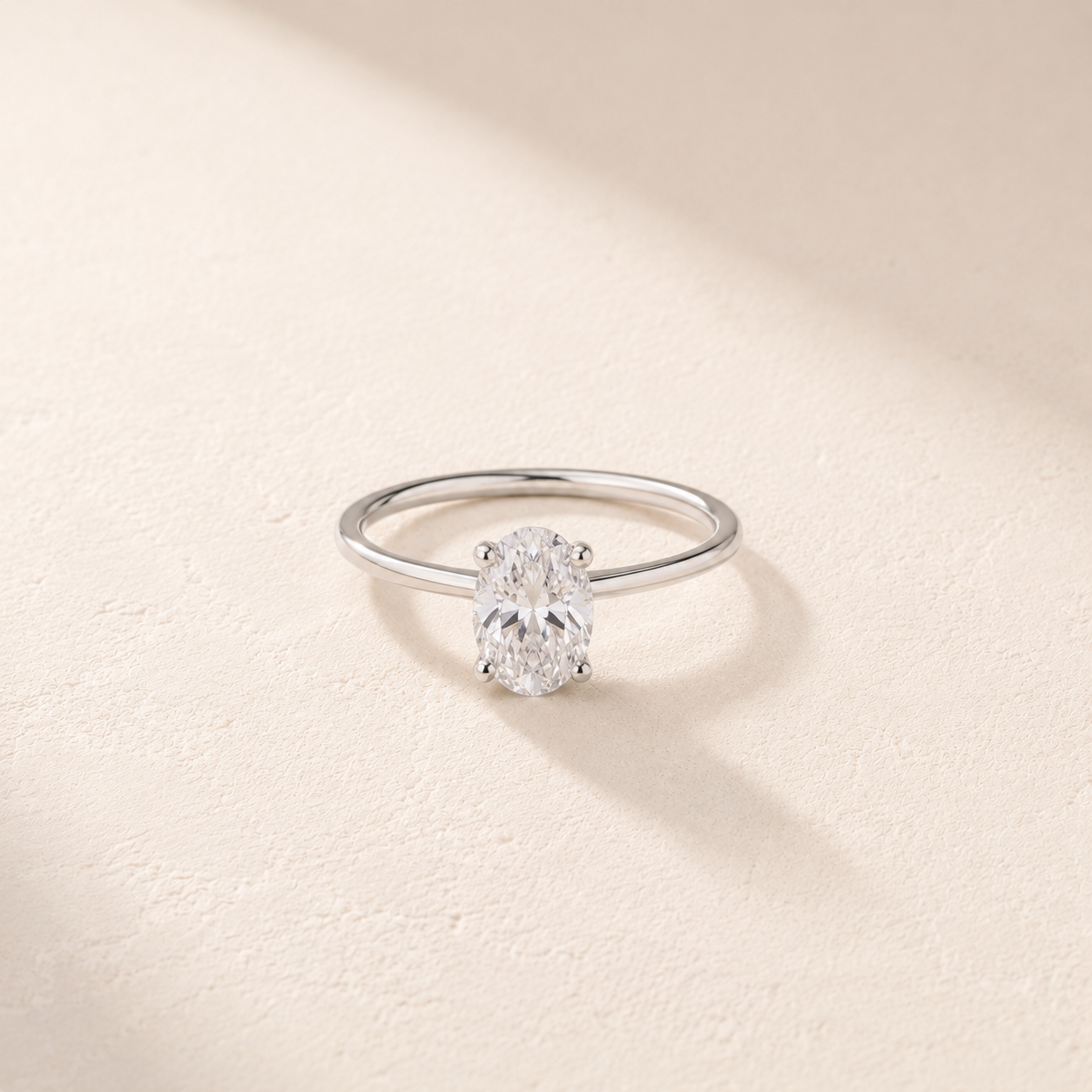 DHARIN Oval Solitaire Ring Slim Band - sterling silver version, side profile view
