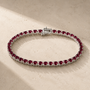 DHARIN Ruby Tennis Bracelet - S925 silver, continuous row lab-grown rubies, flat lay overhead