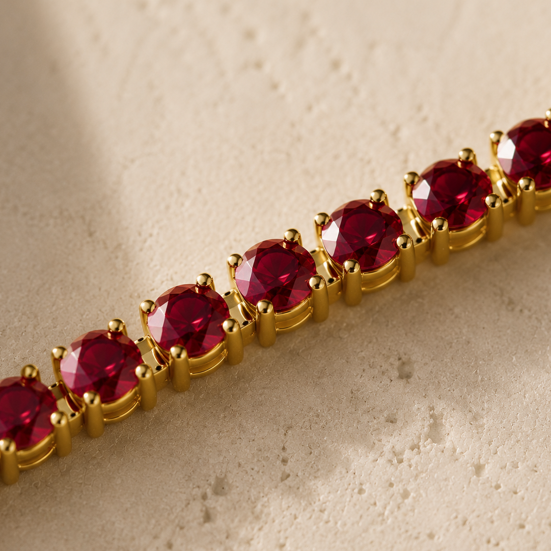 DHARIN Ruby Tennis Bracelet - macro detail, round lab-grown rubies, four-claw setting