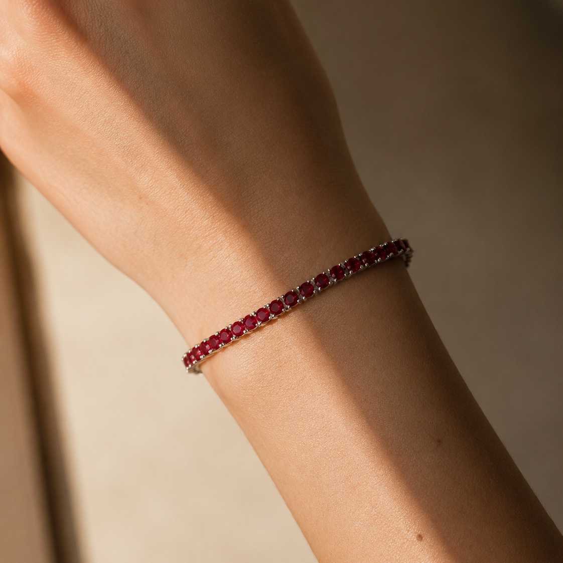 DHARIN Ruby Tennis Bracelet - 45 degree view, continuous ruby row, sterling silver