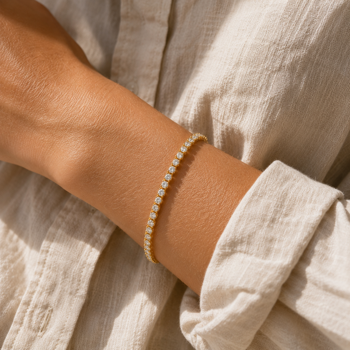 DHARIN diamond tennis bracelet worn at the wrist with a linen shirt