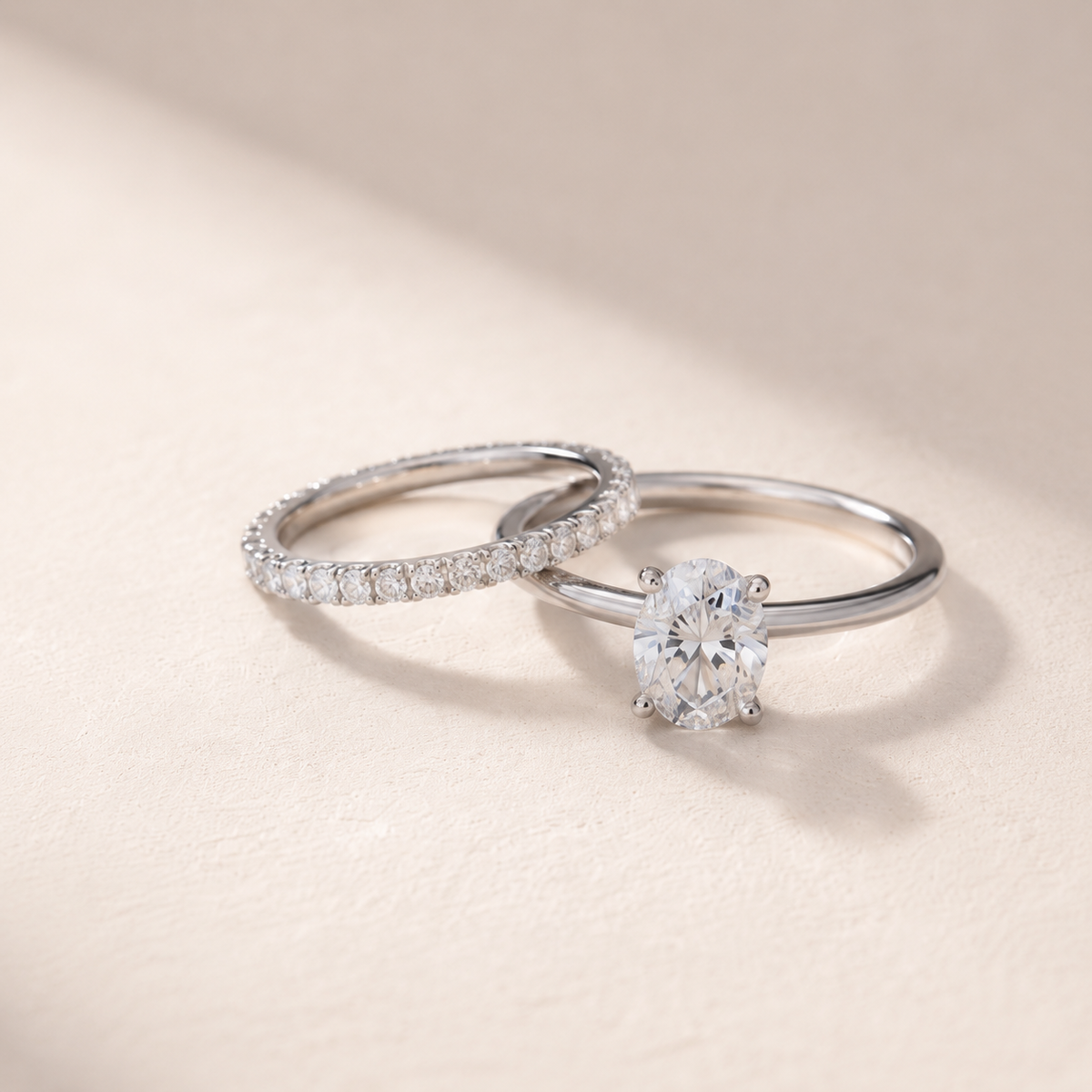 DHARIN Stackable Micro-Pavé Eternity Band paired with oval solitaire ring