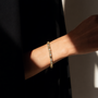 DHARIN Mixed-Cut Tennis Bracelet - close-up wrist lifestyle, alternating diamond cuts catching light